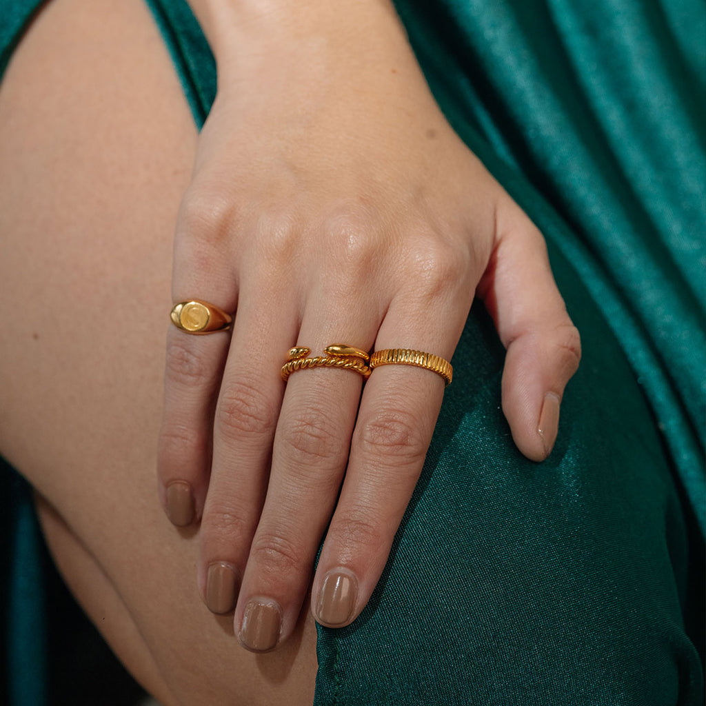 Model wearing 14kt gold rings from Stoned Jewelry
