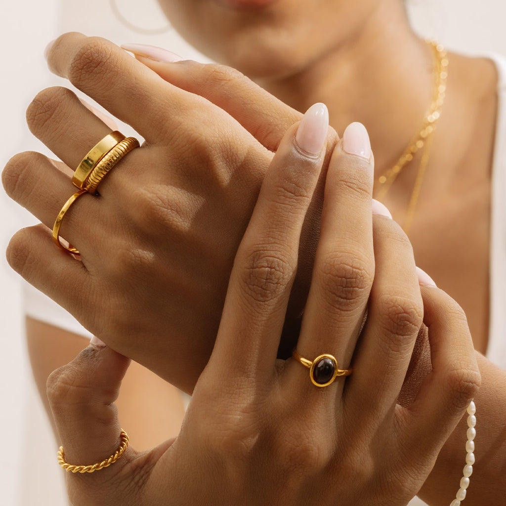 The 14kt groove ring styled along with other rings from Stoned Jewelry